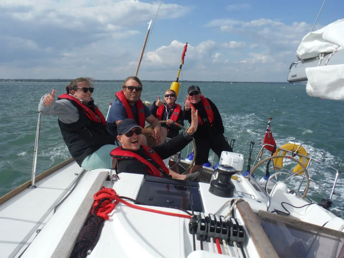 Crew sailing in the Solent during an autumn and winter RYA Competent Crew Course